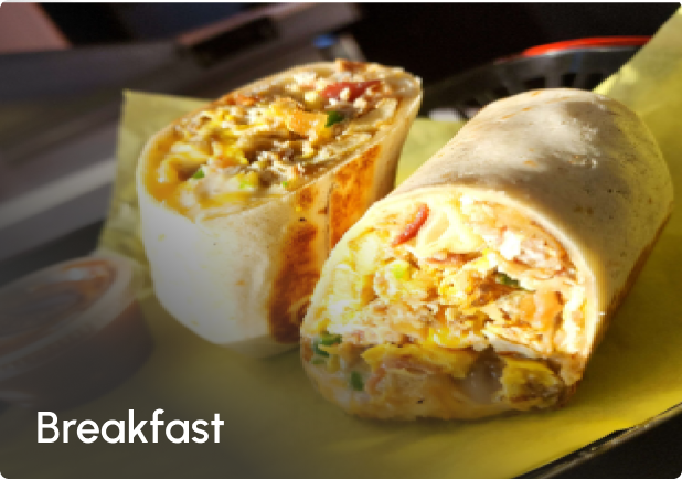 A breakfast burrito is sitting on a piece of paper.